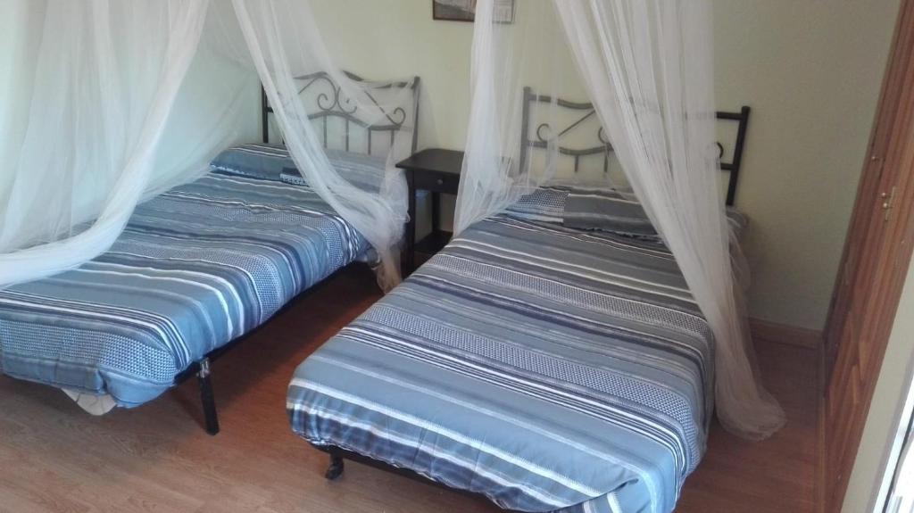 A bed or beds in a room at La Verdevilla