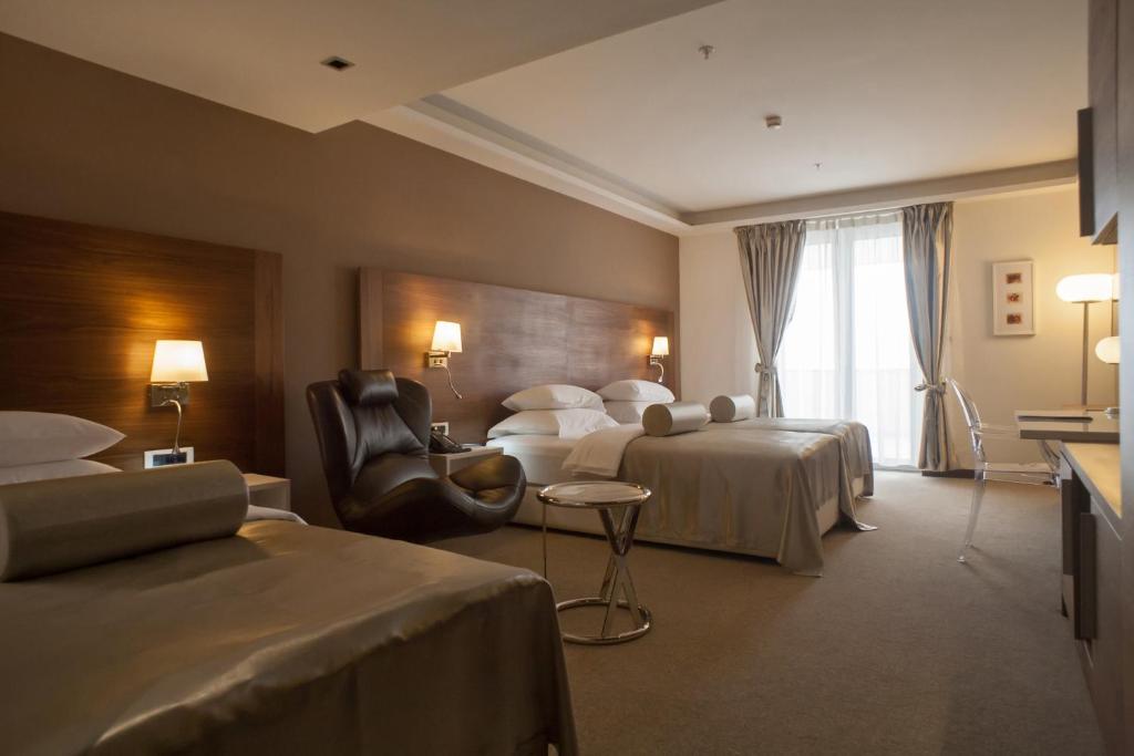 Postel nebo postele na pokoji v ubytování Hotel Aurel