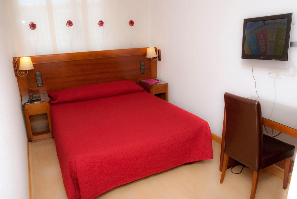 Cama o camas de una habitación en Abadía Burgos Camino Santiago