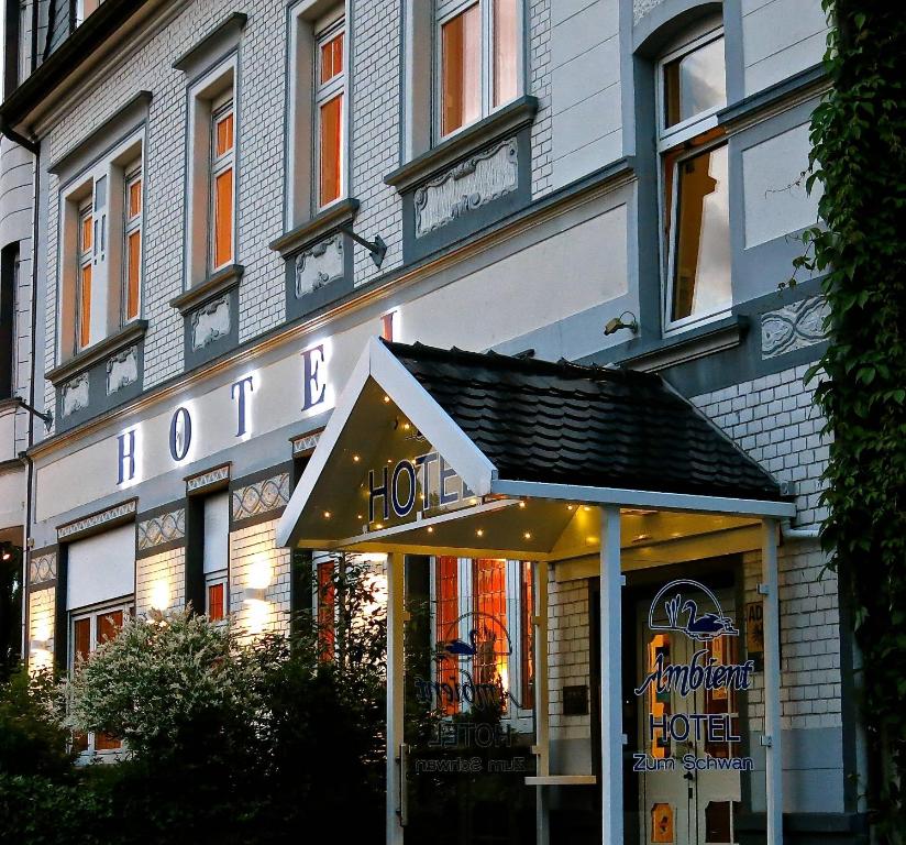 a store front of a building with a sign at Ambient Hotel Zum Schwan in Gelsenkirchen