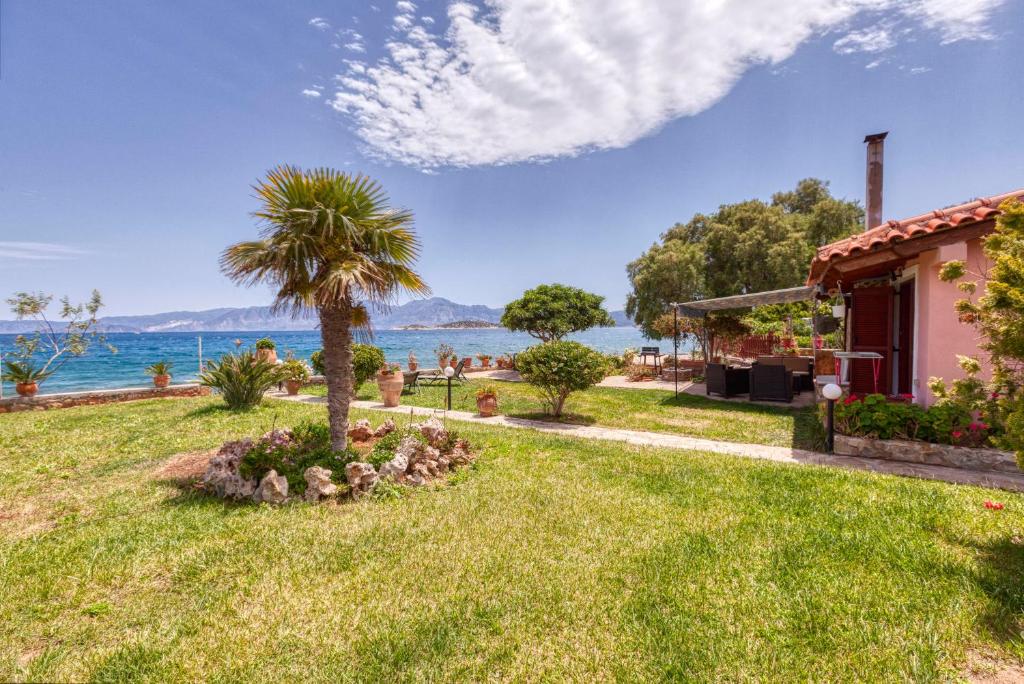 a house with a view of the ocean at Villa Ergina in Agios Nikolaos