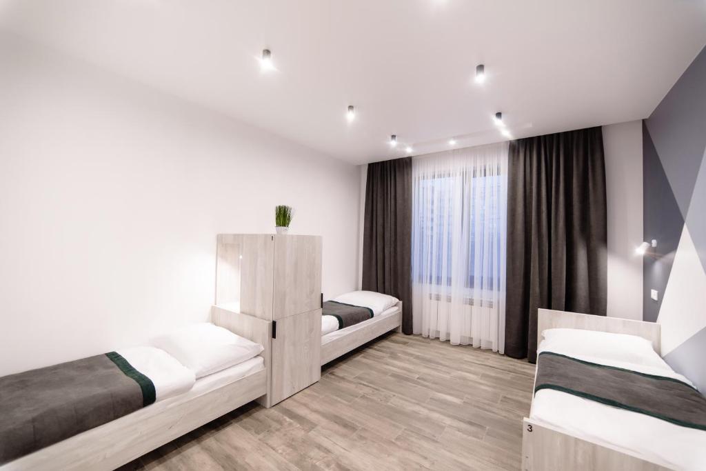 Postel nebo postele na pokoji v ubytování Is’land Hostel