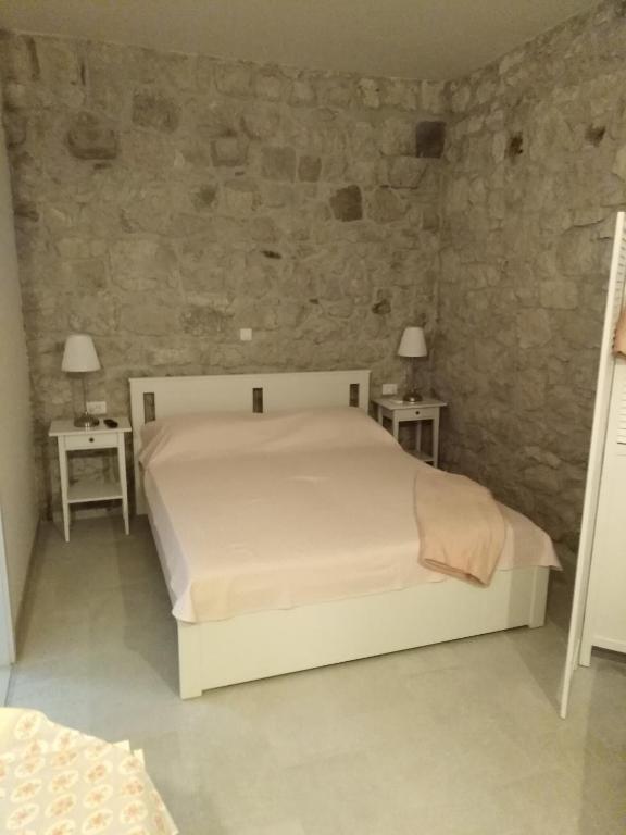 Postel nebo postele na pokoji v ubytování Apartment Iris