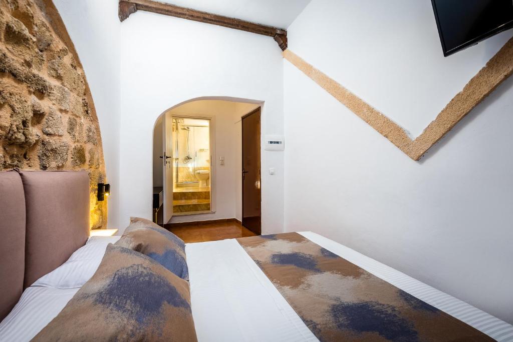 Postel nebo postele na pokoji v ubytování Casa De La Sera