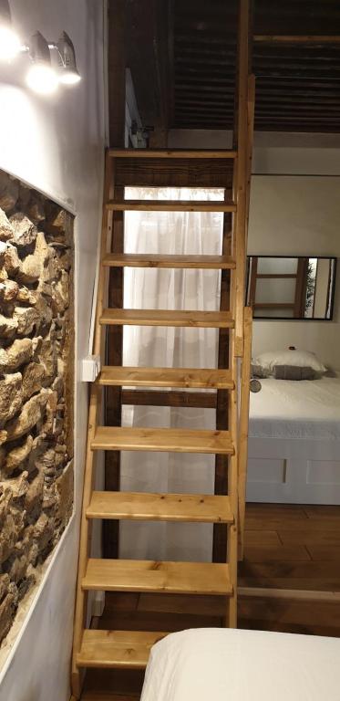 Postel nebo postele na pokoji v ubytování La Loge Du Vieux Lyon