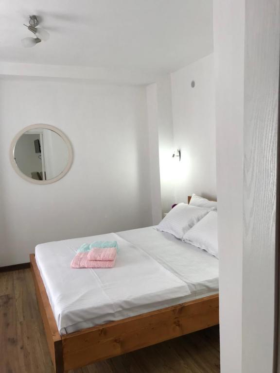A bed or beds in a room at Apartments Kollari