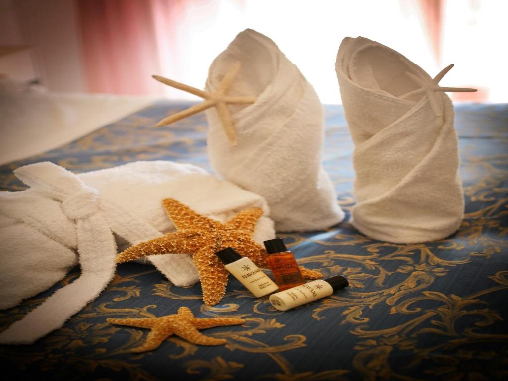 Postel nebo postele na pokoji v ubytování Hotel Mignon Riccione Fronte Mare