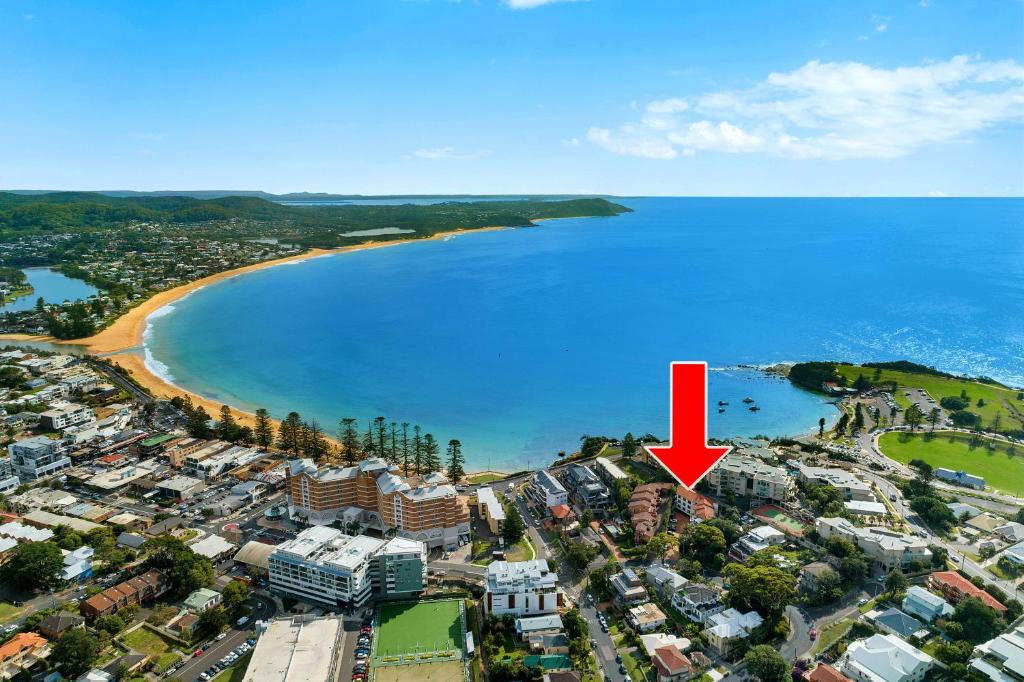 an aerial view of a beach with a red arrow at Terrigal Sails Serviced Apartments in Terrigal