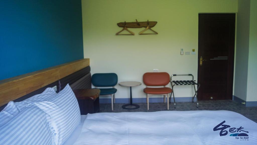 Letto o letti in una camera di Toptai Homestay