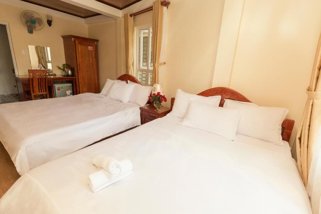 Postel nebo postele na pokoji v ubytování Bình Đào Hotel - Khách sạn ngay trung tâm giá rẻ