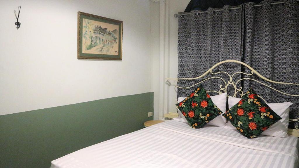Postel nebo postele na pokoji v ubytování The Neighbors Hostel