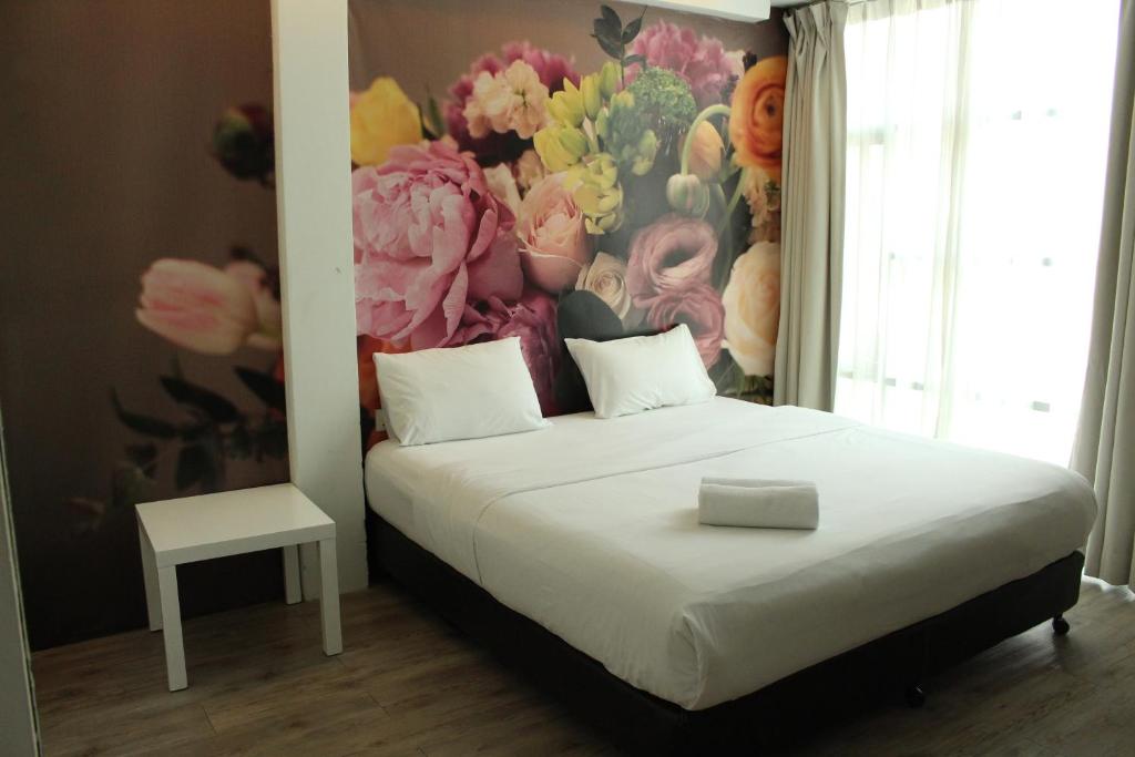 Postel nebo postele na pokoji v ubytování V Garden Hotel