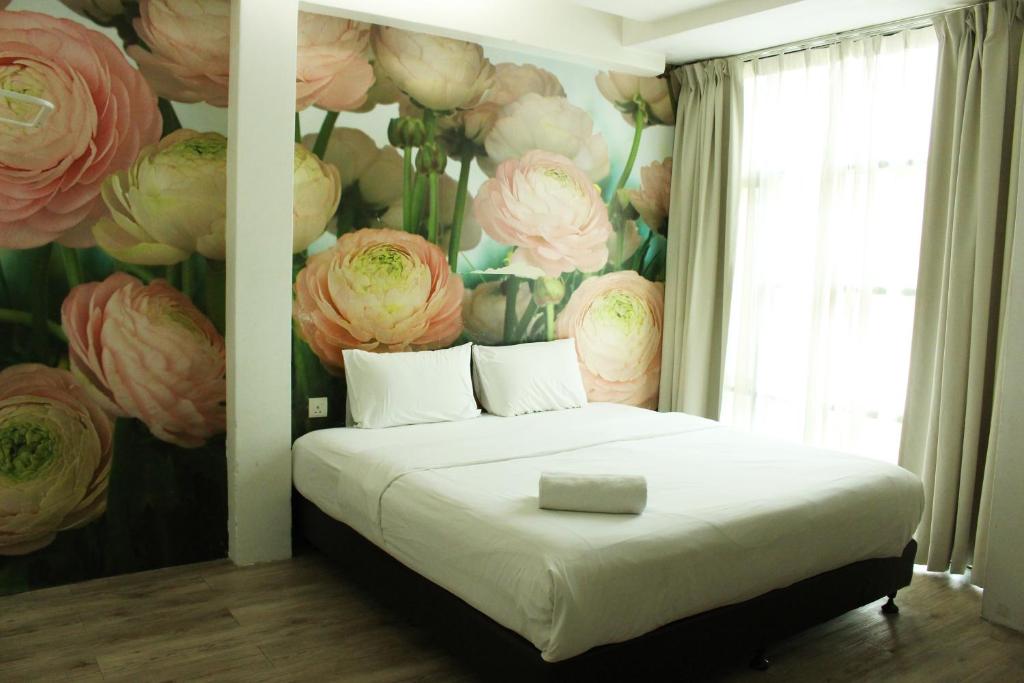 Postel nebo postele na pokoji v ubytování V Garden Hotel