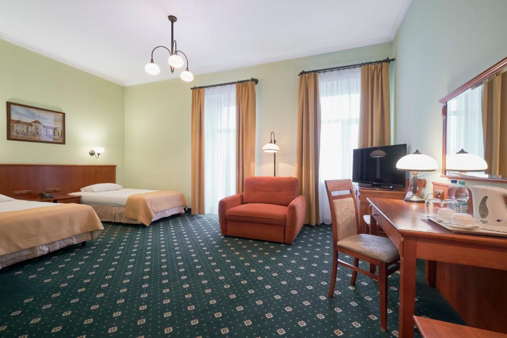 Posteľ alebo postele v izbe v ubytovaní Hotel Hetman