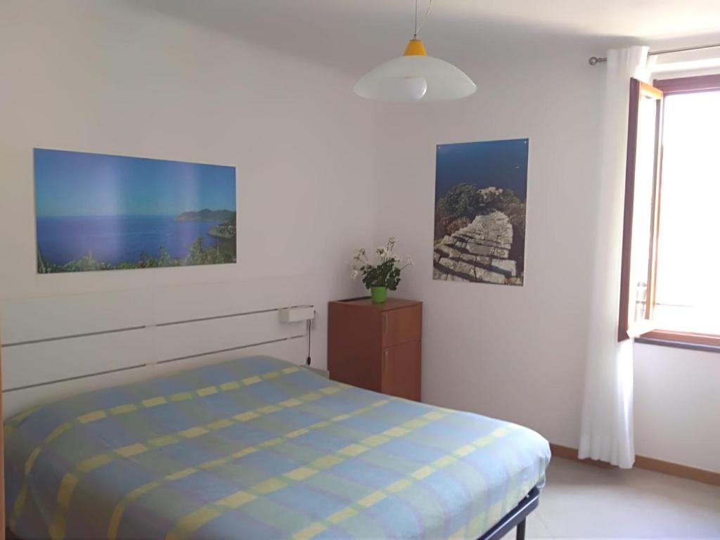 Postel nebo postele na pokoji v ubytování Cà de Angelo