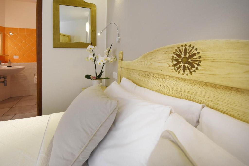 Postel nebo postele na pokoji v ubytování Hotel I Graniti