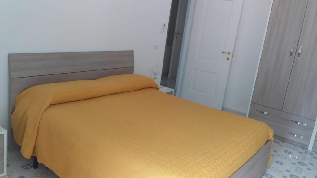 Postel nebo postele na pokoji v ubytování Holidays Baia D'Amalfi
