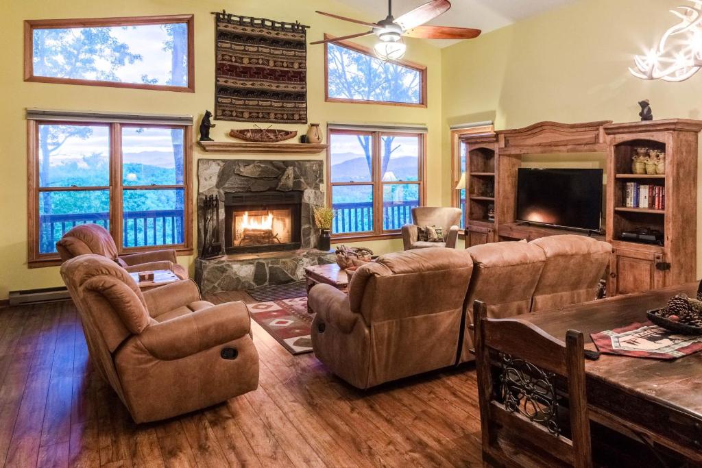 a living room with couches and a fireplace at 3 Bed 3 Bath Vacation home in Sylva in Sylva
