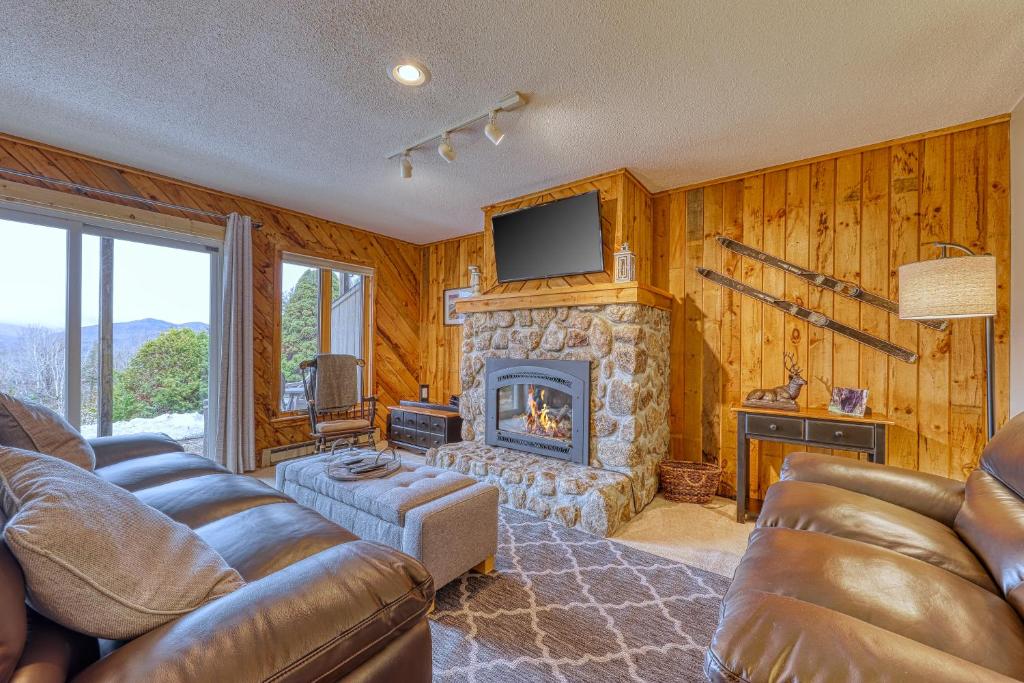 a living room with a couch and a fireplace at Mountain View Home in Bartlett