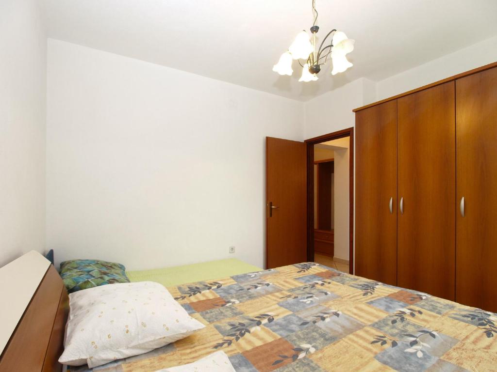 Postel nebo postele na pokoji v ubytování Apartments Miranda 1858