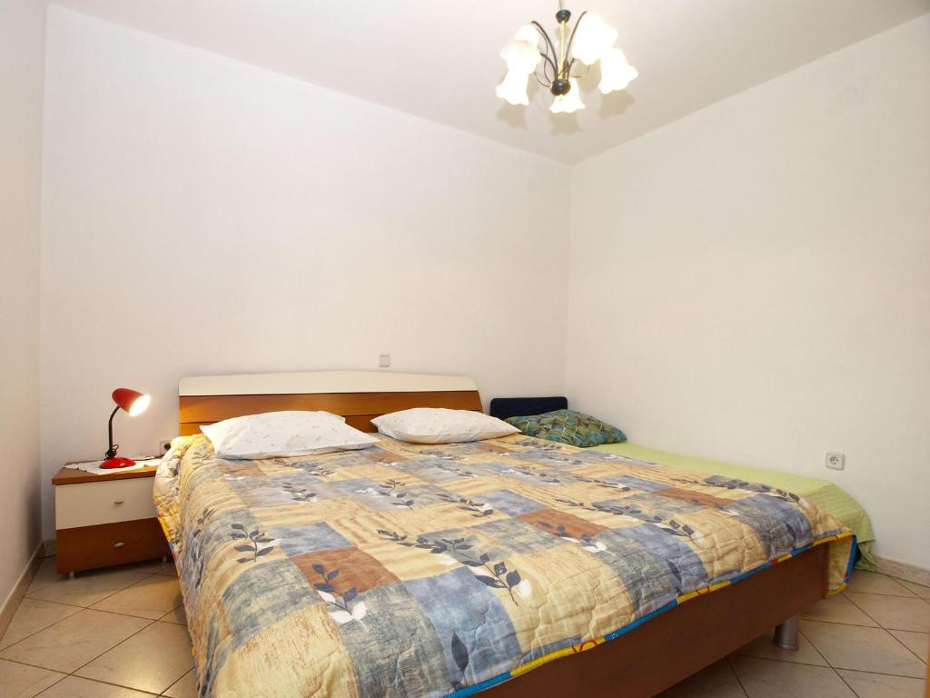 Postel nebo postele na pokoji v ubytování Apartments Miranda 1858