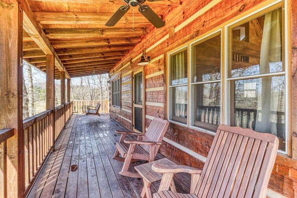 a porch with two rocking chairs and a ceiling fan at 2 Bed 2 Bath Vacation home in Whittier in Whittier