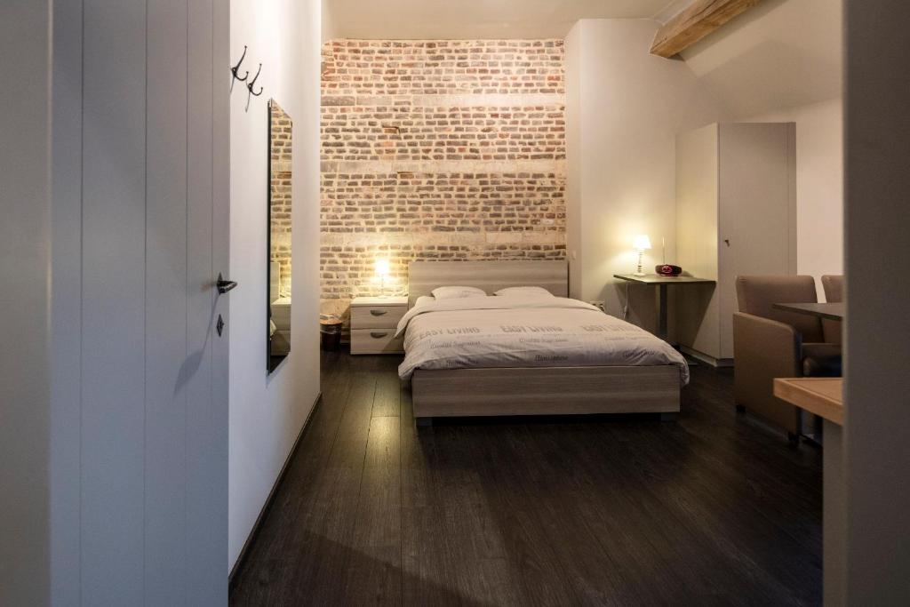 Postel nebo postele na pokoji v ubytování B&B De Oude Winning