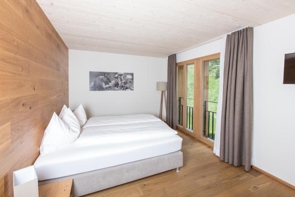 Postel nebo postele na pokoji v ubytování Hotel Reuti