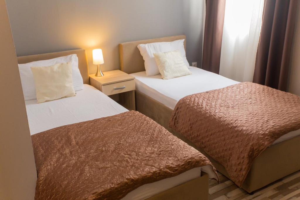 Postel nebo postele na pokoji v ubytování Hotel Hana