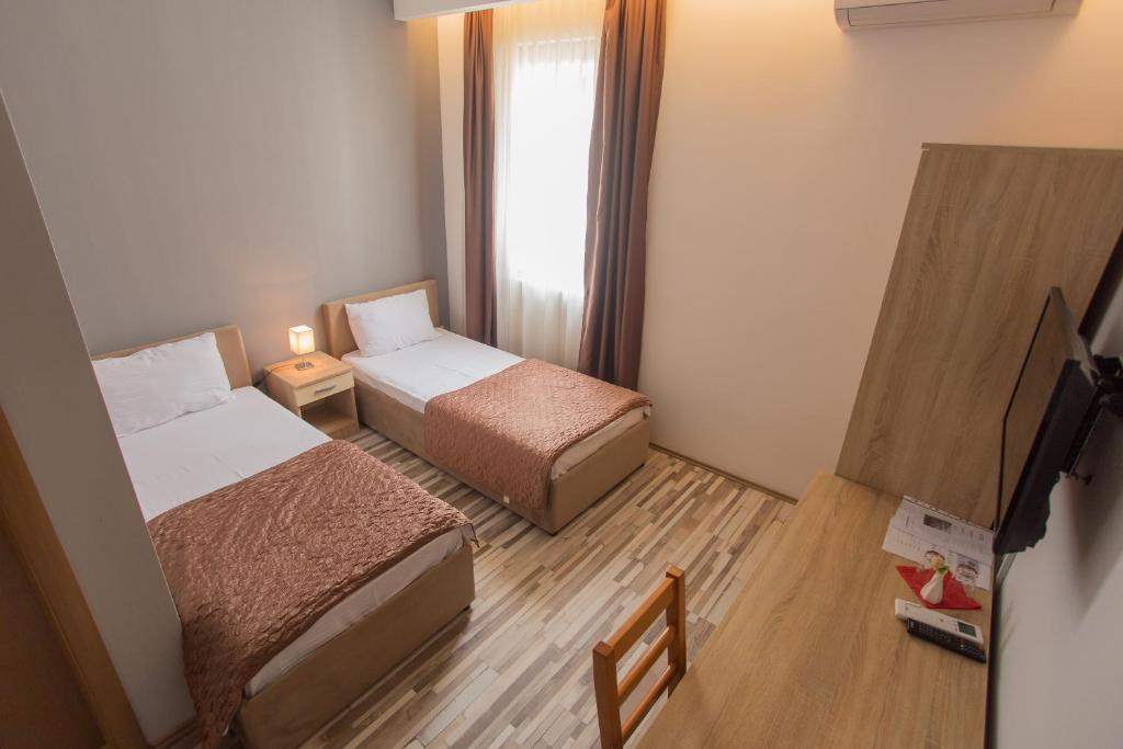 Postel nebo postele na pokoji v ubytování Hotel Hana