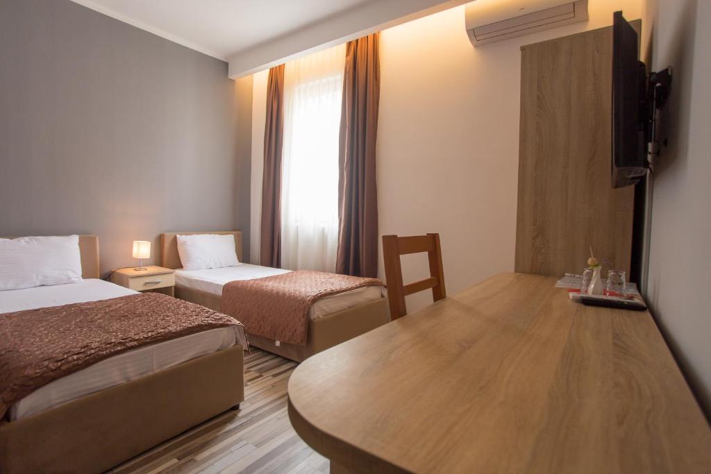 Postel nebo postele na pokoji v ubytování Hotel Hana