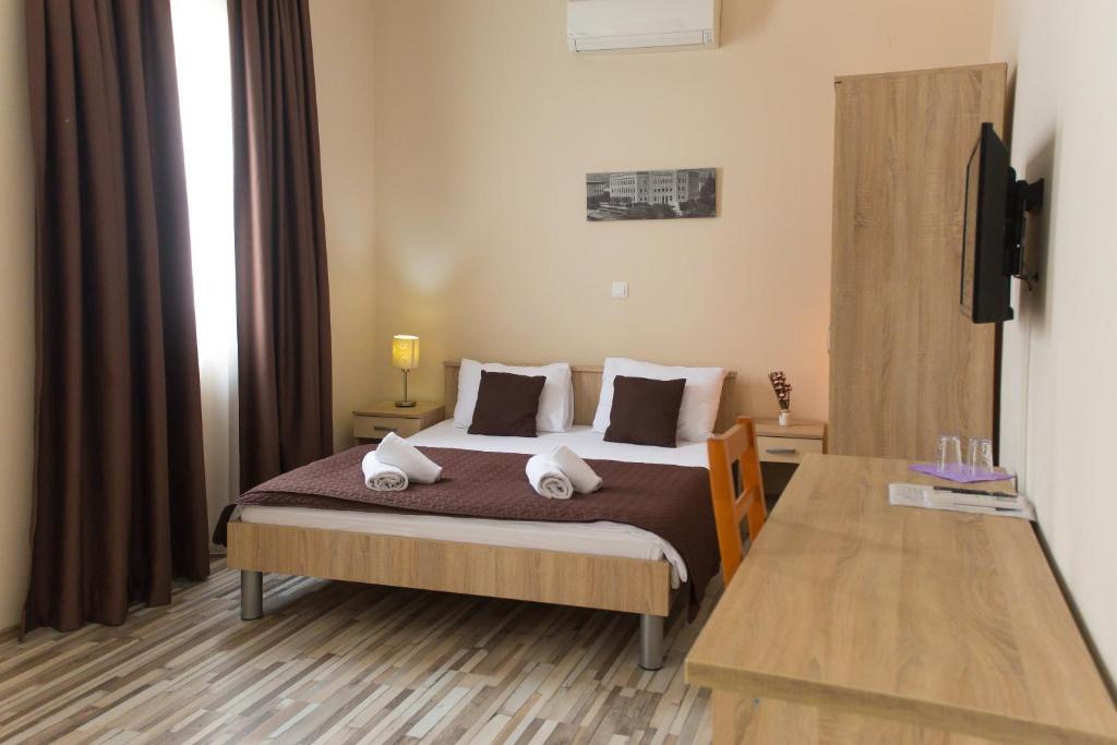 Postel nebo postele na pokoji v ubytování Hotel Hana