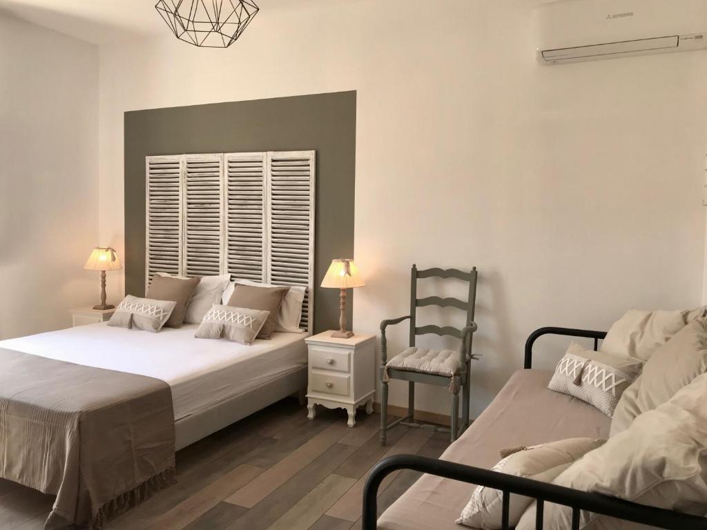 Postel nebo postele na pokoji v ubytování Ô 36 Rempart Sud B&B