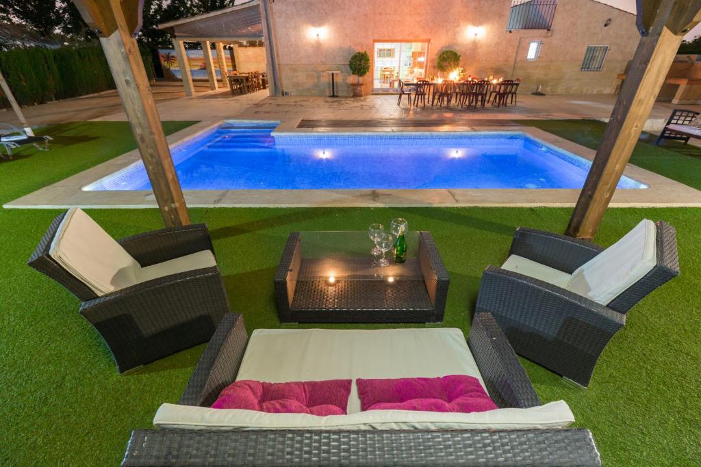 an overhead view of a pool with chairs and a table at Fidalsa Sunny Valley in Catral