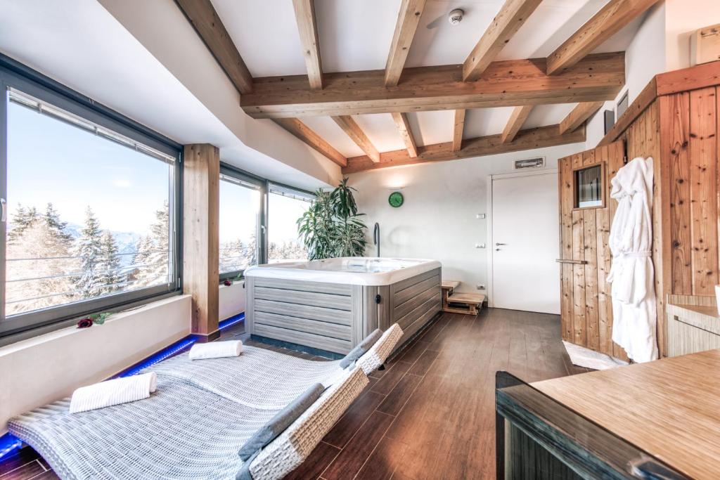 Postel nebo postele na pokoji v ubytování Hotel Montana