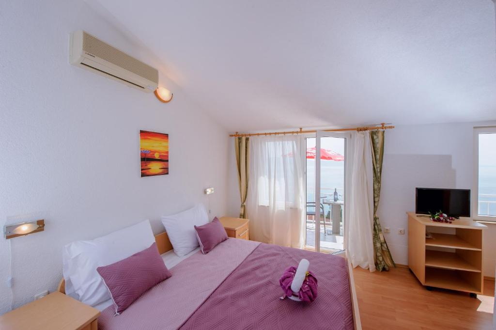 Postel nebo postele na pokoji v ubytování Pension Maric Rooms