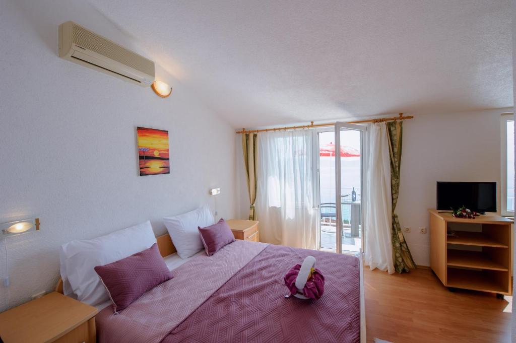 Postel nebo postele na pokoji v ubytování Pension Maric Rooms