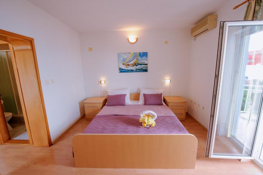 Postel nebo postele na pokoji v ubytování Pension Maric Rooms