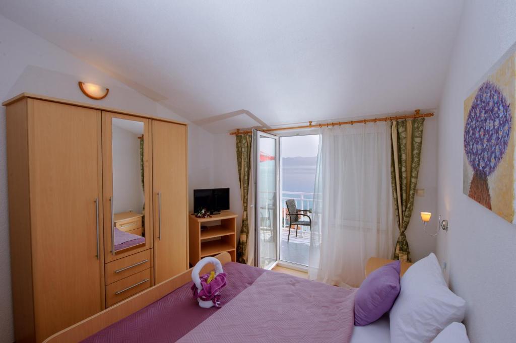 Postel nebo postele na pokoji v ubytování Pension Maric Rooms