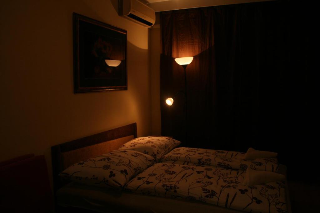 A bed or beds in a room at Royal Studio Apartment