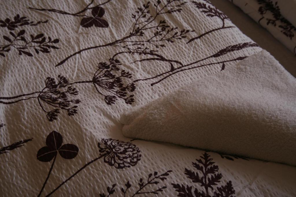 A bed or beds in a room at Royal Studio Apartment