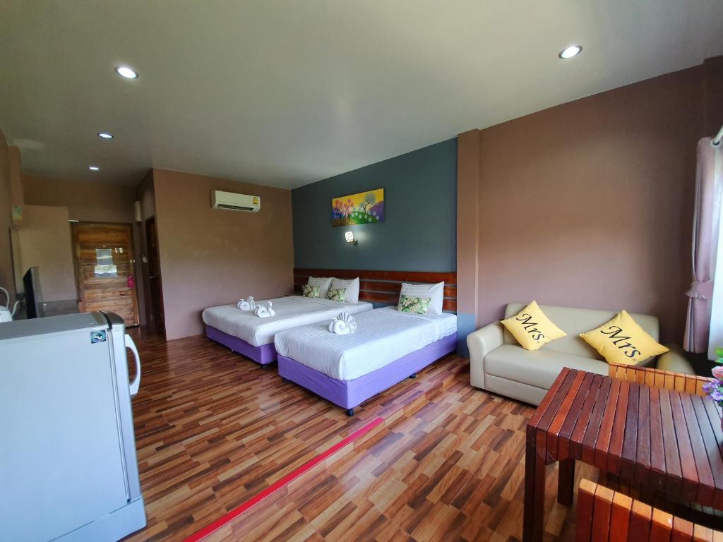 Postel nebo postele na pokoji v ubytování Greenery Resort Koh Tao