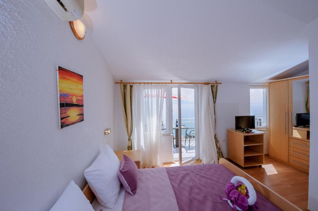 Postel nebo postele na pokoji v ubytování Pension Maric Rooms