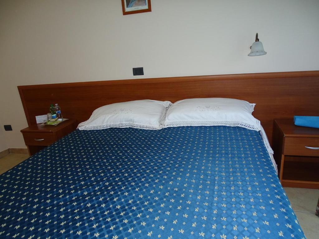 Postel nebo postele na pokoji v ubytování Villa Biancofiore