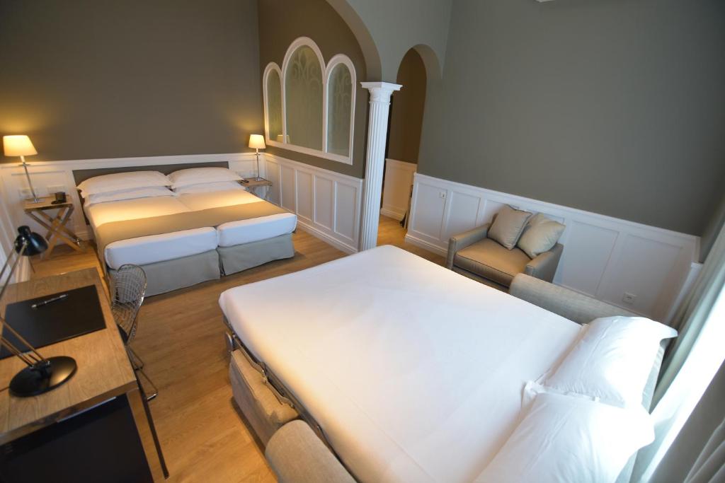Postel nebo postele na pokoji v ubytování Hotel Granvia