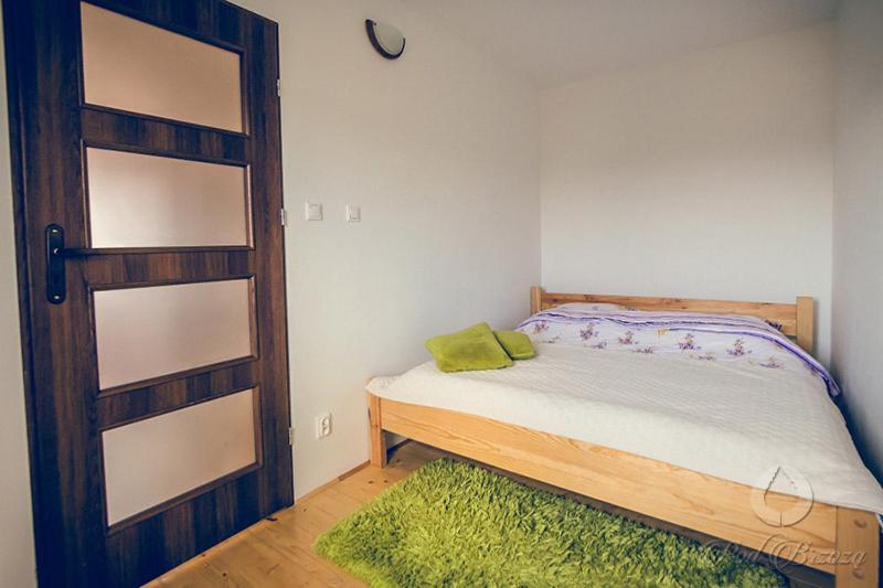 Postel nebo postele na pokoji v ubytování Pod brzozą