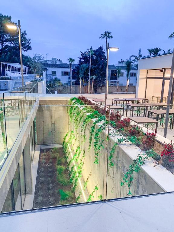 a garden on the side of a building at Hotel Paradiso Garden in Playa de Palma