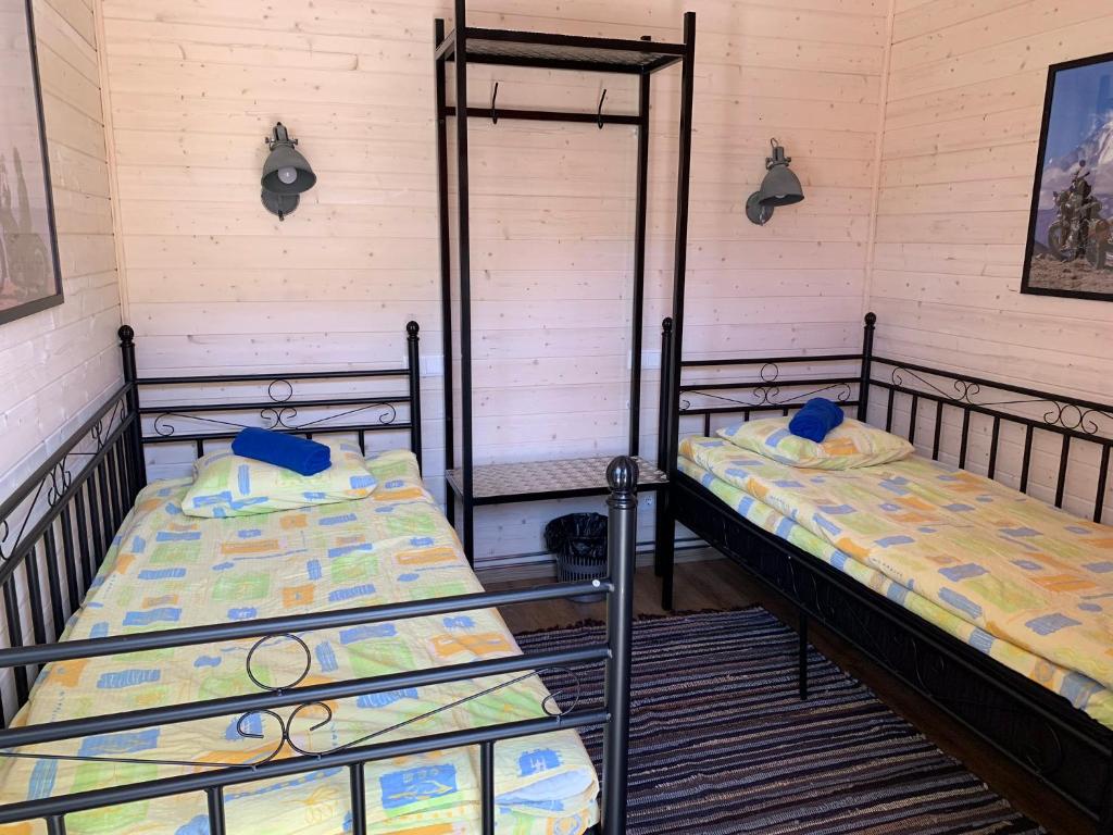 Voodi või voodid majutusasutuse Aleksandri Guesthouse toas
