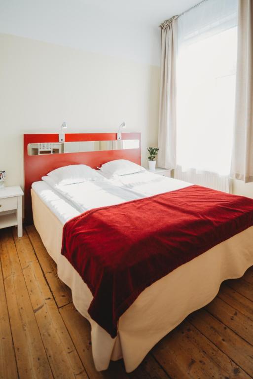 Postel nebo postele na pokoji v ubytování Economy Hotel