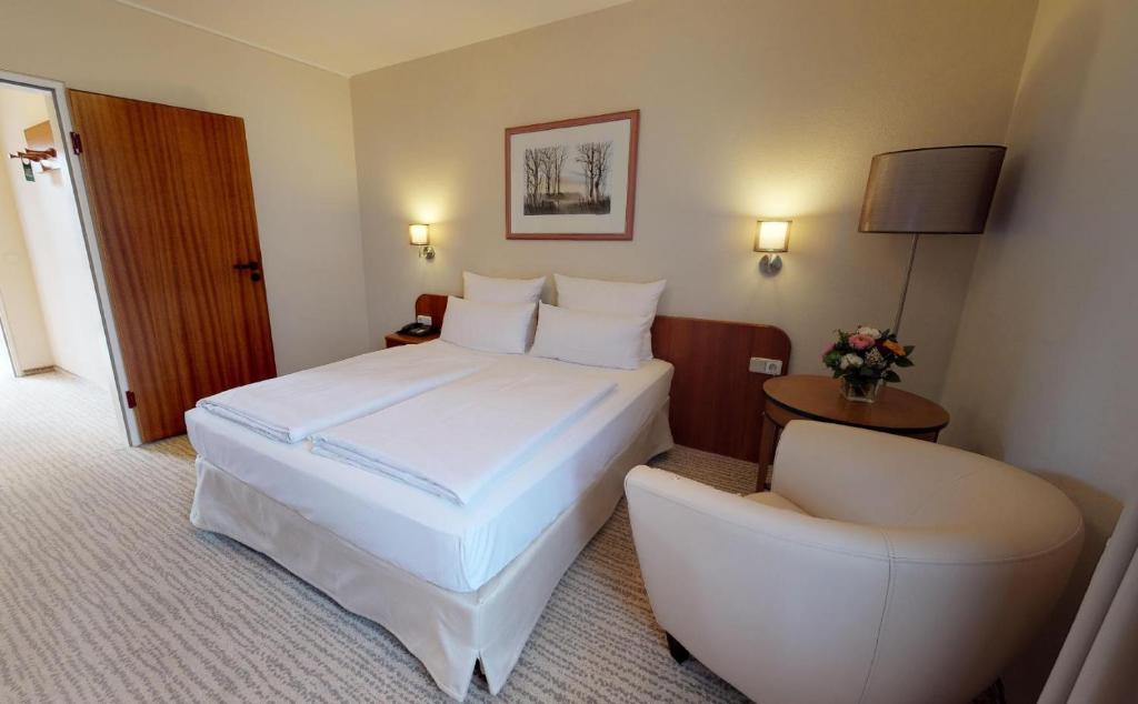 Postel nebo postele na pokoji v ubytování Hotel Engel